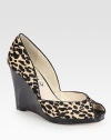 A sturdy wedge lifts this fierce peep toe design of leopard-print calf hair with smooth leather trim. Stacked wedge, 3¾ (95mm)Stacked platform, ¾ (20mm)Compares to a 3 heel (75mm)Leopard-print calf hair upper with leather trimPeep toeLeather lining and solePadded insoleImportedOUR FIT MODEL RECOMMENDS ordering true size. 