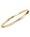 A perfect first bracelet, this small-sized bangle is made of delicately etched 14k gold in a flexible design.