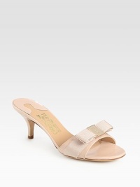 A logo-detailed grosgrain bow lends feminine style to this glossy patent leather slide. Self-covered heel, 2½ (65mm)Patent leather upper with grosgrain ribbon trimLeather lining and solePadded insoleMade in Italy A logo-detailed grosgrain bow lends feminine style to this glossy patent leather slide. Self-covered heel, 2½ (65mm)Patent leather upper with grosgrain ribbon trimLeather lining and solePadded insoleMade in Italy