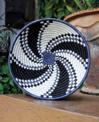 At once home decor, fruit bowl and conversation piece, the Oomva basket is hand woven in a cyclical pattern representative of life. Black- and indigo-dyed sisal and sweetgrass enrich any setting with stunning craftsmanship, color and texture. At once home decor, fruit bowl and conversation piece, the Oomva basket is hand woven in a cyclical pattern representative of life. Black- and indigo-dyed sisal and sweetgrass enrich any setting with stunning craftsmanship, color and texture.