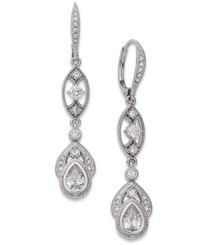 Walk the line between elegant and glamorous. Eliot Danori's stunning Splendor earrings feature gorgeous crystal accents and cubic zirconia (1-1/2 ct. t.w.). Finished with a leverback closure. Set in rhodium-plated mixed metal. Approximate drop: 1-1/4 inches. Walk the line between elegant and glamorous. Eliot Danori's stunning Splendor earrings feature gorgeous crystal accents and cubic zirconia (1-1/2 ct. t.w.). Finished with a leverback closure. Set in rhodium-plated mixed metal. Approximate drop: 1-1/4 inches.