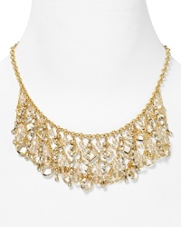 A dramatic cascade of dangling crystals highlights the neckline on this ABS by Allen Schwartz necklace, finished in 12-karat gold plated metal. A dramatic cascade of dangling crystals highlights the neckline on this ABS by Allen Schwartz necklace, finished in 12-karat gold plated metal.