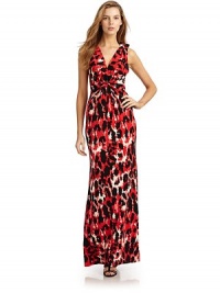 THE LOOKAllover abstract leopard printSmocking at shoulder straps with half bow detailsGathered waist with knot detailKeyhole cutout back button closureTie-backTHE FITAbout 61 from shoulder to hemTHE MATERIALRayonCARE & ORIGINDry cleanMade in USAModel shown is 5'11 (180cm) wearing US size Small. THE LOOKAllover abstract leopard printSmocking at shoulder straps with half bow detailsGathered waist with knot detailKeyhole cutout back button closureTie-backTHE FITAbout 61 from shoulder to hemTHE MATERIALRayonCARE & ORIGINDry cleanMade in USAModel shown is 5'11 (180cm) wearing US size Small.