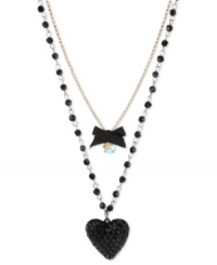 Show your love for the dark side. Betsey Johnson's two-row pendant features a black heart with black-colored crystal accents, black bow with round-cut crystal accents and gold tone chain with black faceted beads. Crafted in antiqued gold tone mixed metal. Approximate length: 16 inches + 3-inch extender. Approximate drop: 3-1/2 inches. Show your love for the dark side. Betsey Johnson's two-row pendant features a black heart with black-colored crystal accents, black bow with round-cut crystal accents and gold tone chain with black faceted beads. Crafted in antiqued gold tone mixed metal. Approximate length: 16 inches + 3-inch extender. Approximate drop: 3-1/2 inches.