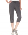Make your workout a little more chic in Nike's capri sweat pants, featuring a comfy pull-on design and elastic hems for a perfect fit.