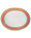 A brilliant line up. The Calypso oval platter brightens every day with hand-painted bands of tropical color in easy-care earthenware. From Clay Art.