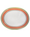 A brilliant line up. The Calypso oval platter brightens every day with hand-painted bands of tropical color in easy-care earthenware. From Clay Art.