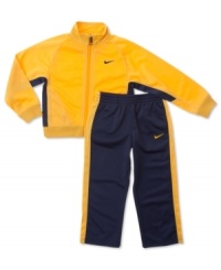 He'll be suited up in cute sporty style with this Nike track jacket and pants. He'll be suited up in cute sporty style with this Nike track jacket and pants.