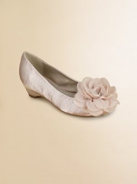 A graceful ballerina style on a tiny heel with a sweet rosette of layered tulle at the toe.Faux leather polyurethane upperTulle rosette with rhinestone centerCovered heel with rubber soleSelf liningPadded insoleImported A graceful ballerina style on a tiny heel with a sweet rosette of layered tulle at the toe.Faux leather polyurethane upperTulle rosette with rhinestone centerCovered heel with rubber soleSelf liningPadded insoleImported