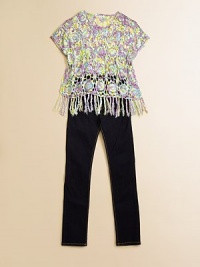 An airy, poncho-style, crocheted design with fringed hem in a vivid palette.ScoopneckShort sleevesPullover styleFringed hem50% rayon/50% cottonHand washImported An airy, poncho-style, crocheted design with fringed hem in a vivid palette.ScoopneckShort sleevesPullover styleFringed hem50% rayon/50% cottonHand washImported