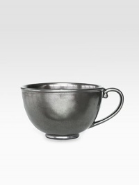 A unique mottling technique lends a hand-thumbed, hammered design to a beautiful metallic stoneware coffee cup with the look of an old-world favorite. From the Pewter Collection10-oz. capacity3H X 4½ diam.Ceramic stonewareDishwasher safeImported