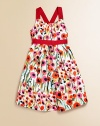 In cotton sateen with a painterly floral pattern and adorable grosgrain trim, this cross-back party dress is a must-have for stylish little ones.Spaghetti straps, cross at backGathered necklineConcealed back-zip closureGathered waist with grosgrain trimHem falls above kneeCottonDry cleanMade in USA of Italian fabrics