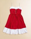An eye-catching colorblock design with ruffles and a full skirt make this fancy frock the ultimate must-have.Sweetheart necklineAdjustable spaghetti strapsPullover styleRuffled ribbon bodice with button detailFull skirt92% polyester/8% spandexHand washMade in the USA of imported fabric
