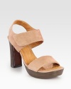 Soft suede style with a secure slingback, stacked heel and wide, adjustable straps. Stacked heel, 4 (100mm)Island platform, 1 (25mm)Compares to a 3 heel (75mm)Suede upperLeather lining and solePadded insoleMade in SpainOUR FIT MODEL RECOMMENDS ordering one size up as this style runs small. 