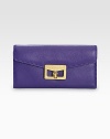 EXCLUSIVELY AT SAKS in Royal Purple. Rich pebble-grain leather in a flap-front silhouette, finished with signature logo-stamped hardware.Turnlock flap closureOne inner zip compartmentThree inside open pocketsSix inside card slotsFully lined7½W X 3½H X 1/2DImportedBoxed for giving
