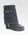 Suede wedge ankle boot with a foldover shaft and side zip closure. Self-covered wedge, 4 (100mm)Covered platform, ½ (15mm)Compares to a 3½ heel (90mm)Suede upperExposed side zip and adjustable strapLeather liningRubber trek solePadded insoleImported