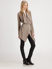 Featherweight wool crepe in an elegant drape-front topper, cinched at the waist by a chic leather belt.Gathered asymmetrical necklineSingle button closureWrap frontSkinny leather beltAbout 39 from shoulder to hemWoolDry cleanMade in USA of imported fabricModel shown is 5'10 (177cm) wearing US size Small. Featherweight wool crepe in an elegant drape-front topper, cinched at the waist by a chic leather belt.Gathered asymmetrical necklineSingle button closureWrap frontSkinny leather beltAbout 39 from shoulder to hemWoolDry cleanMade in USA of imported fabricModel shown is 5'10 (177cm) wearing US size Small.