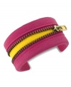 Peek-a-boo! BCBGeneration's whimsical cuff bracelet features a zipper in the center that reveals a yellow accent underneath for a vibrant touch. Crafted in PVC.  Approximate length: 8 inches.