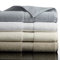Bath mat with a contemporary textured dobby in four classic colors. Bath mat with a contemporary textured dobby in four classic colors.