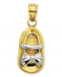 Commemorate your brand new bouncing baby girl. This precious charm features a baby shoe in 14k gold with rhodium ribbon and strap details. Chain not included. Approximate length: 1 inch. Approximate width: 2/5 inch.