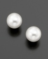 Unparalleled elegance in the form of a simple pearl: Belle de Mer's lovely stud earrings feature cultured freshwater pearls (5-1/2 - 6 mm) set in 14k gold.