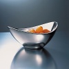 A flutter in mid-motion. Refreshingly innovative, each Nambe' piece is an achievement of precision, balance and function. Individual artists use Nambe', a superior metal alloy that retains heat and cold for ideal serving temperatures. Made in USA.