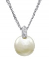 Singularly spectacular. One white man-made pearl (18 mm) stuns in this three-chain necklace by Majorica. Sterling silver setting shines with sweeping cubic zirconia accents. Approximate length: 18 inches. Approximate drop: 3/4 inch.