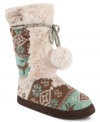 Fun and cozy is the name of this game. Muk Luk's Jewel faux-fur booties feature a funky pattern and pompon detail on the shaft.