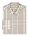 A broad check pattern blending tonal hues distinguishes this handsome dress shirt from Burberry.