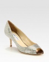 Instantly chic peep toe pump crafted of glitter fabric with a mesh stitched overlay. Textured metallic leather heel, 2¾ (70mm)Glitter-coated fabric upperPeep toeLeather lining and solePadded insoleMade in Italy