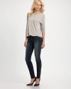 Dark-wash skinnies styled with contrasting leather trim and slight fading. THE FITSkinny fitRise, about 8½Inseam, about 30THE DETAILSButton closureZip flyFour-pocket styleFully linedBody: 92% cotton/7% polyester/1% spandex; Contrast: LeatherDry cleanMade in USAModel shown is 5'10 (177cm) wearing US size 24.