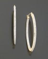 A sparkling diamond-accent design updates a classic style. Set in 14k gold. Approximate diameter: 1-1/2 inches.