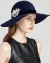 Top off your look with elegance in Kathy Jeanne's velour floppy hat, adorned with a removable, bow-shaped crystal pin.