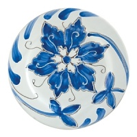 Handmade from terra-cotta and handpainted in Tuscany, this vivid round platter offers an Italian twist on traditional blue-and-white porcelain for a fresh look on the table. Handmade from terra-cotta and handpainted in Tuscany, this vivid round platter offers an Italian twist on traditional blue-and-white porcelain for a fresh look on the table.
