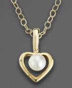 The perfect gift for your favorite little sophisticate. Suspended in the center of this elegant open heart pendant is a lustrous cultured pearl. Crafted of 14k gold. Chain measures 15.
