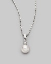 Simple and lovely, a white, round cultured Akoya pearl has a sparkling diamond accent, plus a chain and setting of 18k gold. 7mm white round cultured pearl Quality: A+ Diamond, 0.05 tcw 18k white gold Length, about 18 Spring ring clasp Imported