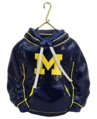 Fitting for Michigan alum, this hand-painted hoodie ornament trims the tree in Wolverines maize and blue. Glitter amps up the school and holiday spirit. Fitting for Michigan alum, this hand-painted hoodie ornament trims the tree in Wolverines maize and blue. Glitter amps up the school and holiday spirit.
