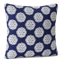 Floral medallions in white and indigo on a field of bold blue are hand printed on this decorative pillow. Floral medallions in white and indigo on a field of bold blue are hand printed on this decorative pillow.