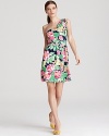 A breezy silhouette lends movement to vibrant florals for a Lilly Pulitzer dress blooming with feminine charm. Complement the bouquet of hues with color-pop pumps.