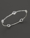 From the Silver collection, five clear quartz stations on a hammered bangle in sterling silver. Designed by Ippolita.