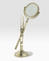 This fully functioning standing magnifier is crafted in a vintage-inspired silhouette from antiqued brass. 11½H X 4 diam.Brass and glassImported