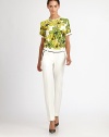 A bold, colorful botanical print decorates this crisply tailored top.Jewel necklineContrast trim at shoulders and cuffsBack zipSilk liningViscoseDry cleanMade in USA of imported fabricModel shown is 5'10 (177cm) wearing US size 4. 