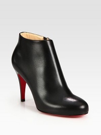 Sleek leather ankle boot distinguished by a stacked heel and convenient side zipper. Stacked heel, 3 (75mm)Leather upperSide zipperLeather liningSignature red leather solePadded insoleMade in ItalyOUR FIT MODEL RECOMMENDS ordering one size up as this style runs small. Sleek leather ankle boot distinguished by a stacked heel and convenient side zipper. Stacked heel, 3 (75mm)Leather upperSide zipperLeather liningSignature red leather solePadded insoleMade in ItalyOUR FIT MODEL RECOMMENDS ordering one size up as this style runs small.