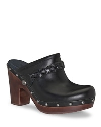 Shining studs and pretty braid detailing echo classic '70s styling. Pair these UGG® Australia clogs with a full skirt or soft denim to complete the look. Shining studs and pretty braid detailing echo classic '70s styling. Pair these UGG® Australia clogs with a full skirt or soft denim to complete the look.