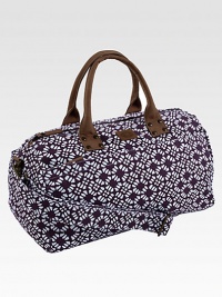 A graphic floral pattern is both sweet and sophisticated, printed on sturdy cotton in a roomy duffel.Top zip closureLeather double handlesDetachable, adjustable shoulder strapInside and outside zip pockets18¾L X 9½H X 9¼DCottonSpot cleanImported