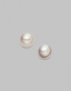 Classic, elegant stud earrings set in 18K yellow gold. 4.5mm white cultured pearls 18K yellow gold Post backs Imported 
