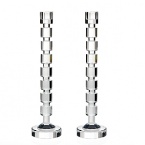 For over 160 years, Italian-based Ricci Argentieri has created superlatively crafted designs of timeless style. In that spirit, these elegant candleholders feature alluring cut cylinders.