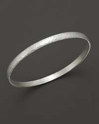 This textured silver bracelet makes a subtle, sophisticated statement. This textured silver bracelet makes a subtle, sophisticated statement.