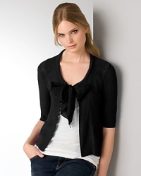 Lush silk habotai trim lends a refined look and feel to DKNY's lovely, chic cardigan. For signature style, drape over a fitted tank, your revered dark denim and leopard-print flats. Lush silk habotai trim lends a refined look and feel to DKNY's lovely, chic cardigan. For signature style, drape over a fitted tank, your revered dark denim and leopard-print flats.
