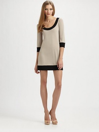 Bold contrast bands trim the edges of this easy-to-wear pull-on design.Banded scoopneckThree-quarter sleeves with banded cuffsBanded hemlineAbout 17½ from natural waist95% polyester/5% spandexMachine washMade in USA of imported fabricModel shown is 5'10 (177cm) wearing US size Small. Bold contrast bands trim the edges of this easy-to-wear pull-on design.Banded scoopneckThree-quarter sleeves with banded cuffsBanded hemlineAbout 17½ from natural waist95% polyester/5% spandexMachine washMade in USA of imported fabricModel shown is 5'10 (177cm) wearing US size Small.